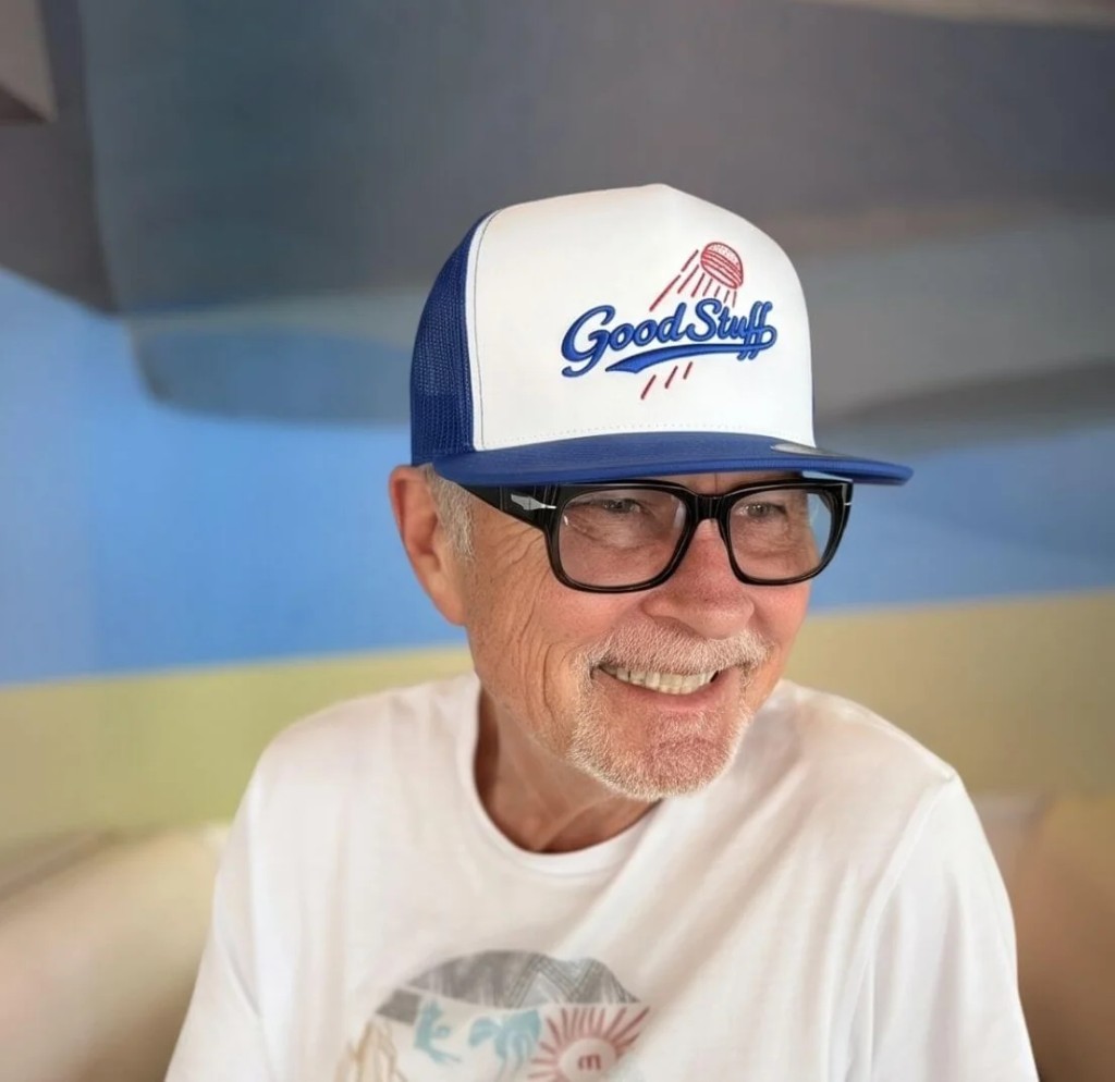 A Good Stuff guest smiling in a branded trucker hat